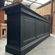 Immense bar counter covered with blue stone.