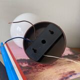 Red plastic wall light with a white opaline glass globe.