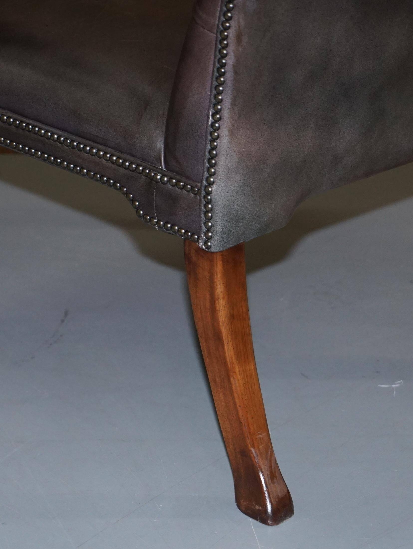 Gainsborough armchair George II leather Chesterfield hand-carved with claw and ball feet.
