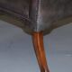 Gainsborough armchair George II leather Chesterfield hand-carved with claw and ball feet.