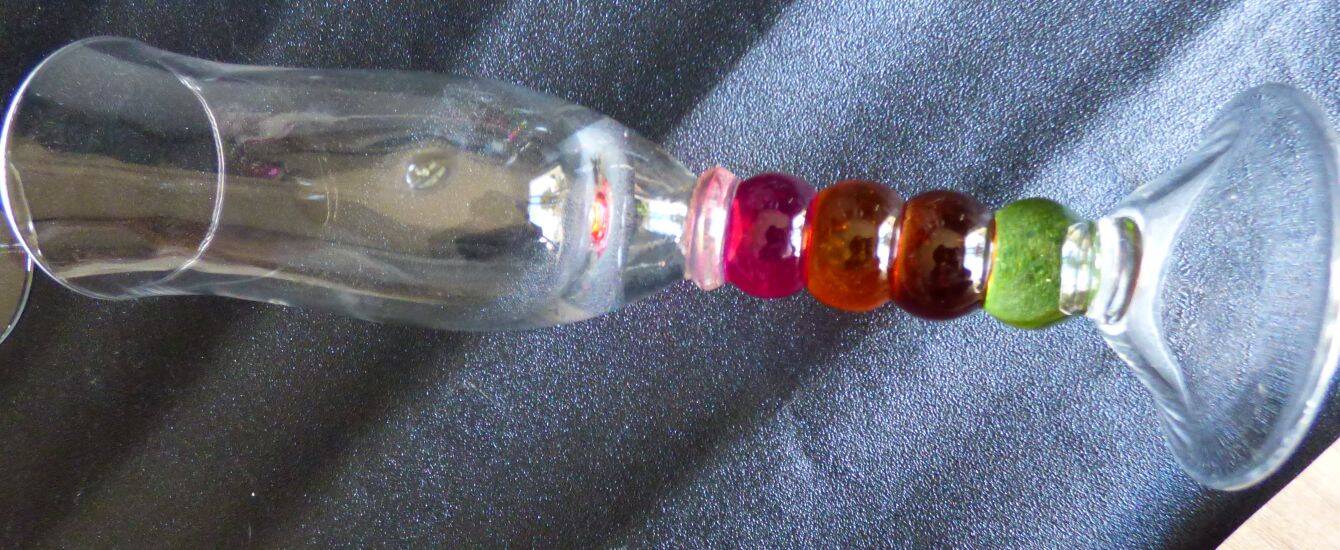 4 vintage flutes with coloured glass stems