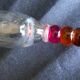 4 vintage flutes with coloured glass stems