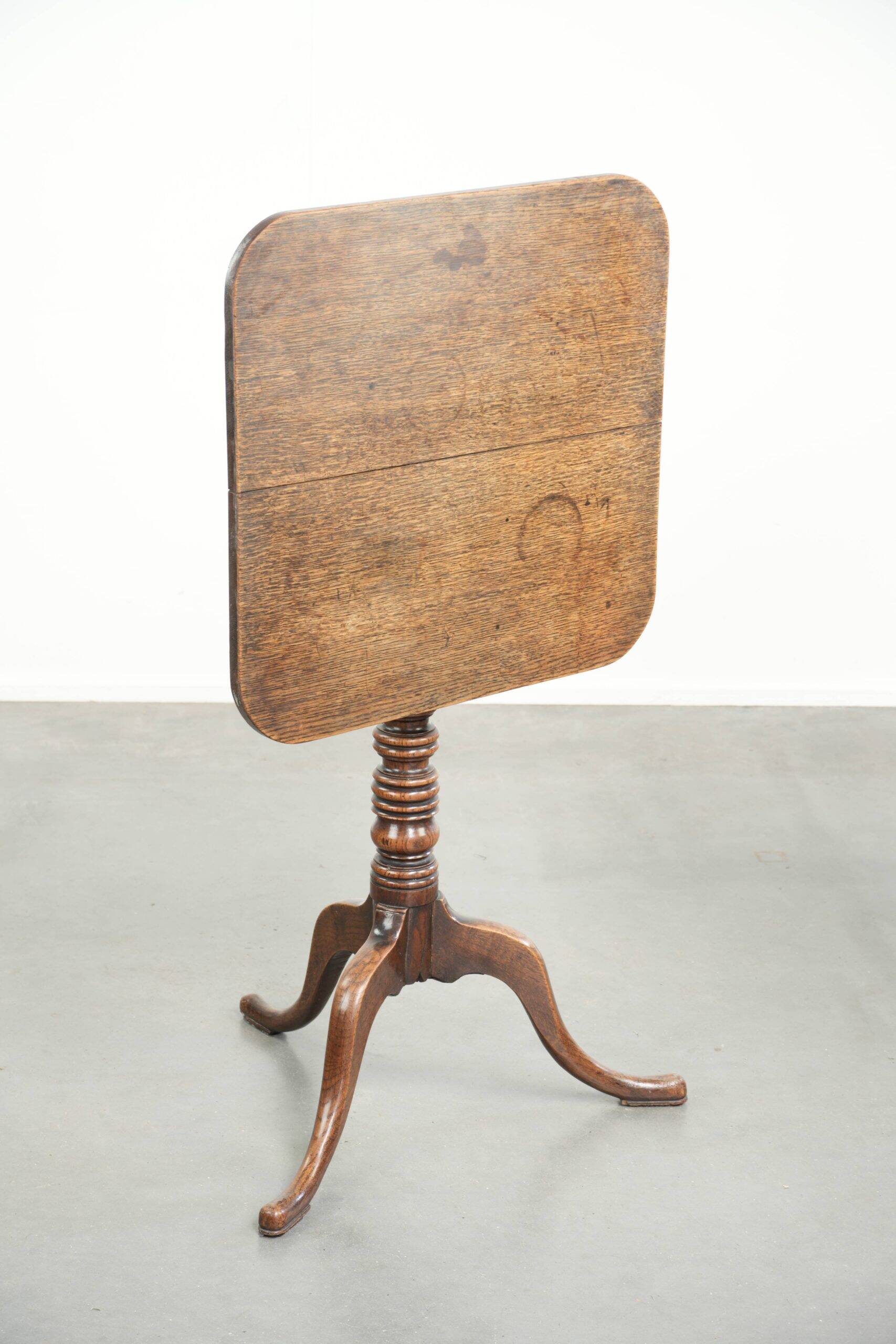 Antique English oak tilt top table from the 19th century in a unique shape