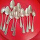 11 Small silver-plated spoons.