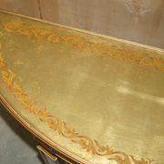 Half-moon console Eglomise Theodore Alexander with a gold finish.