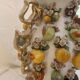 Large antique vase with relief decorations of coloured fruits.