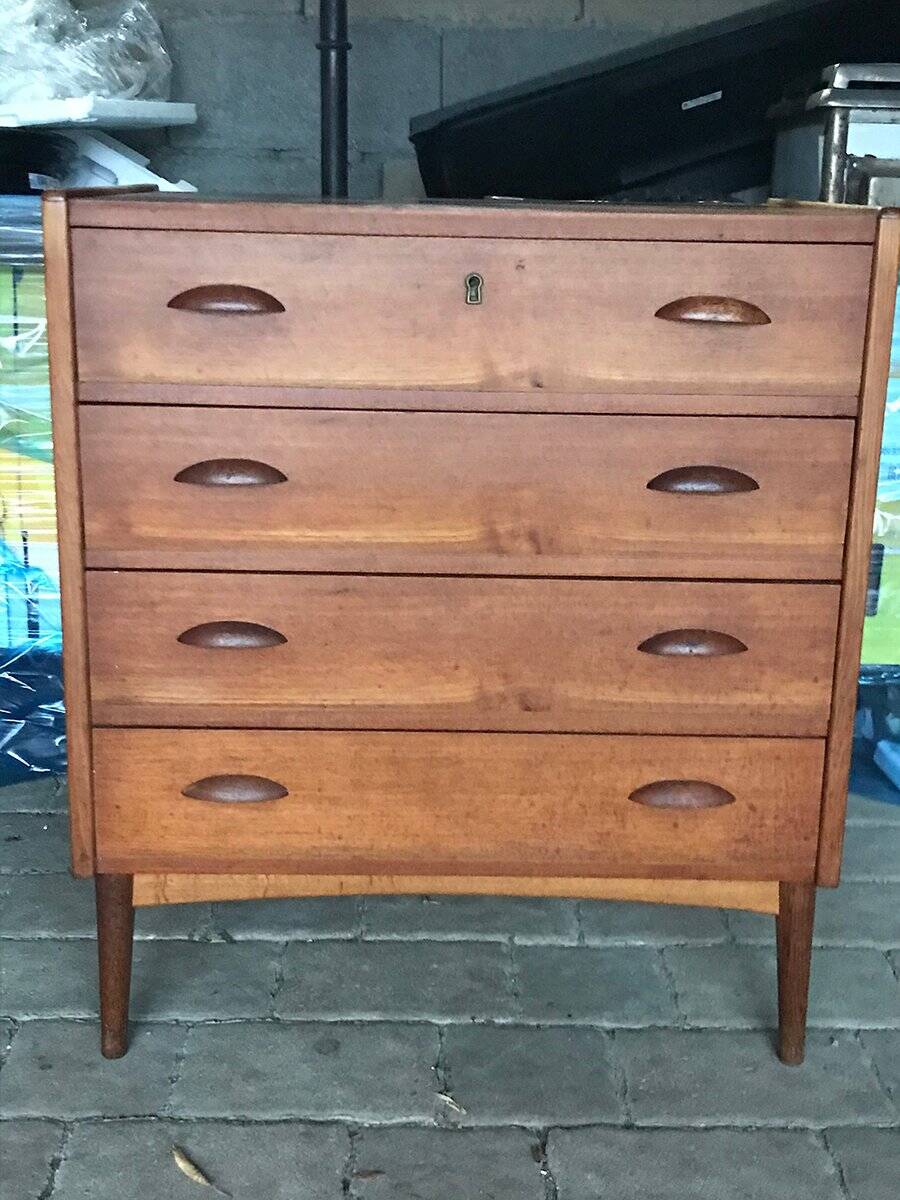 Danish commode from the 1960s in brown teak, with 4 drawers and elegant tapered legs.