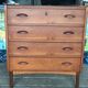 Danish commode from the 1960s in brown teak, with 4 drawers and elegant tapered legs.