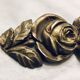 Fronton with bronze roses