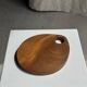 Small circular teak monoxyle cutting board with handle 22 x 13.