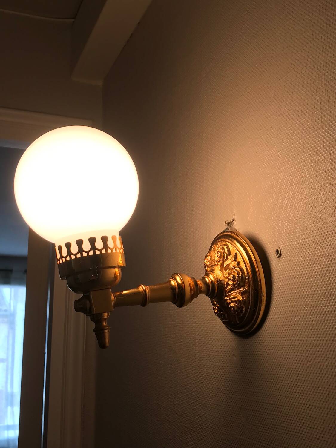 Brass and opal glass wall lights