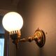 Brass and opal glass wall lights