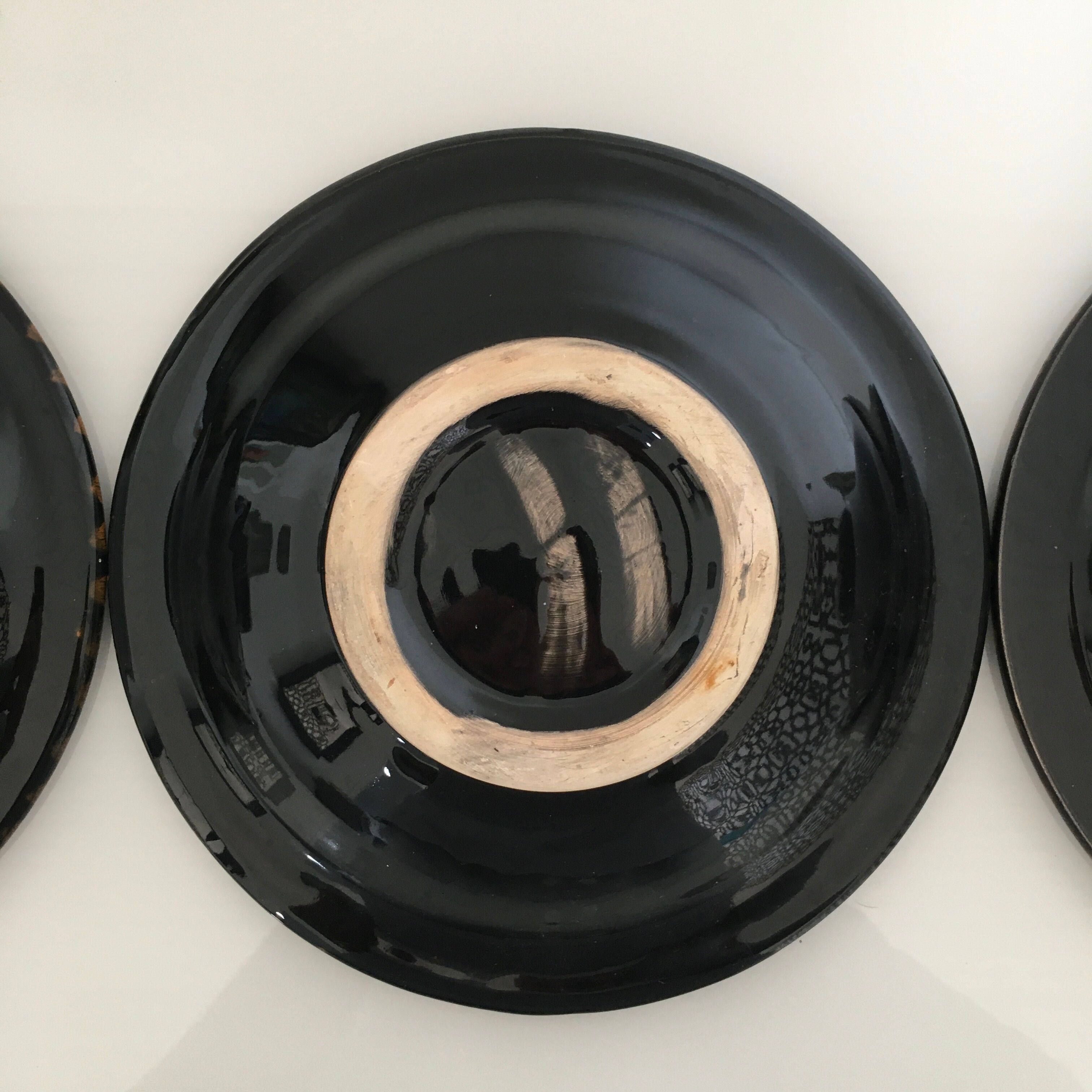 Set of 3 black decorative deep plates.