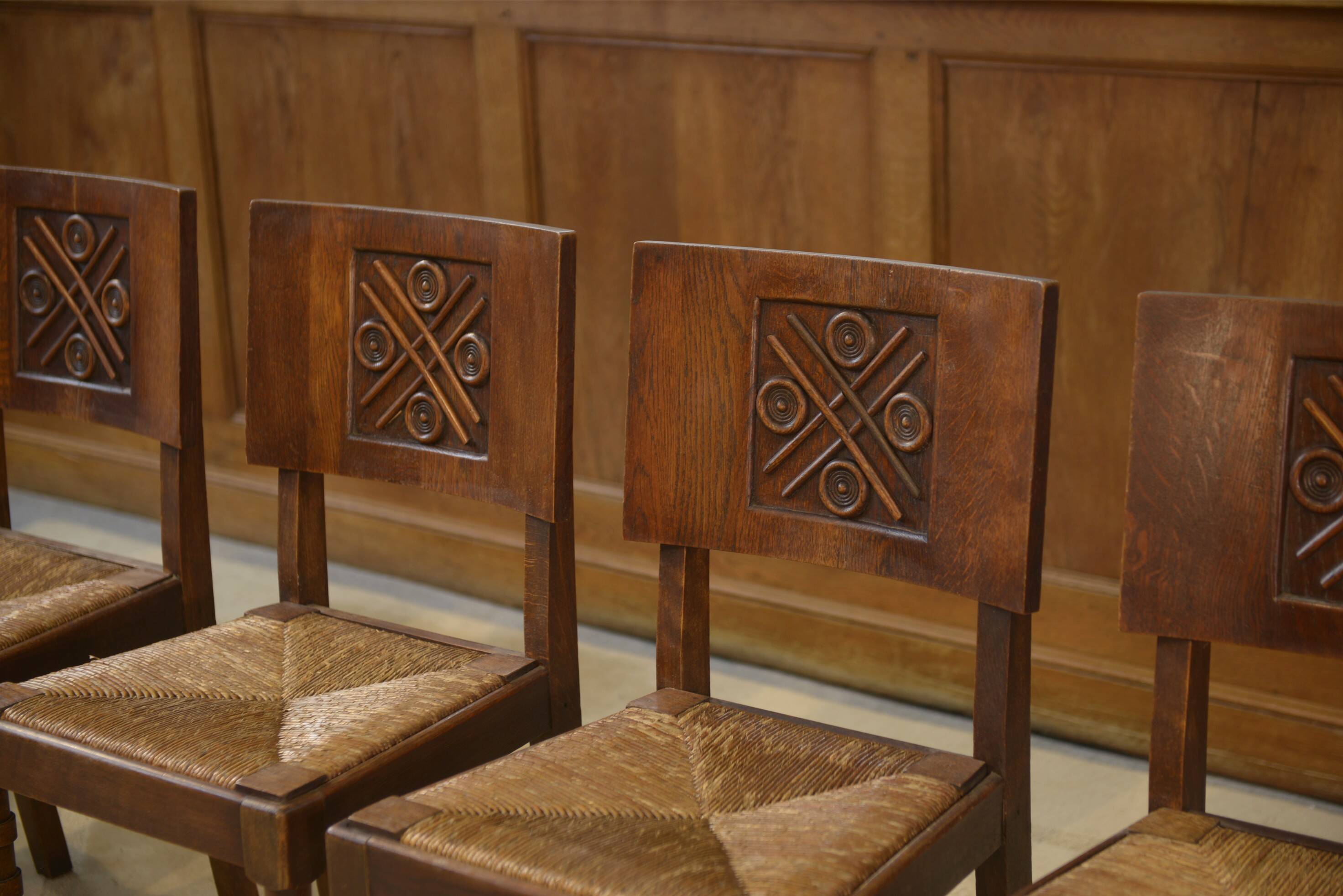 Ensemble de 6 chaises Charles Dudouyt en chêne 1950’s