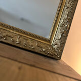 Gilded mirror with antique wood and stucco frame