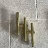 Tubular wall sconces in brass, Italian design from the 1970s, attributed.