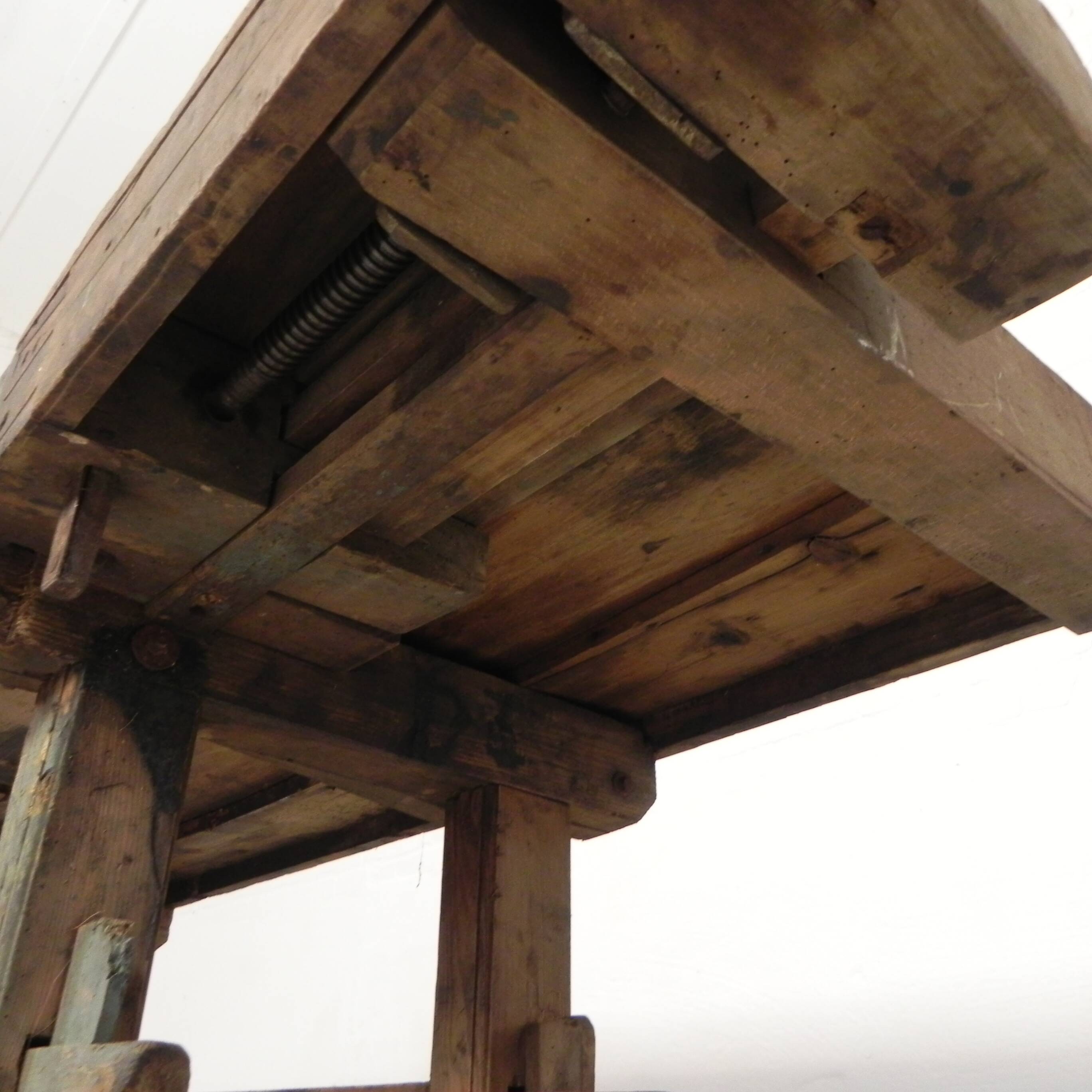 Wooden industrial workbench with vice, 194 cm long, 1930s.