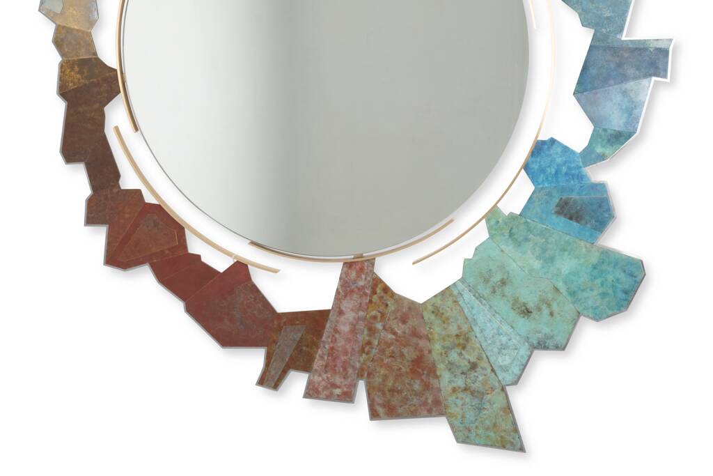 Contemporary mirror in oxidized bronze and brass with a deconstructed shape.