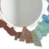 Contemporary mirror in oxidized bronze and brass with a deconstructed shape.