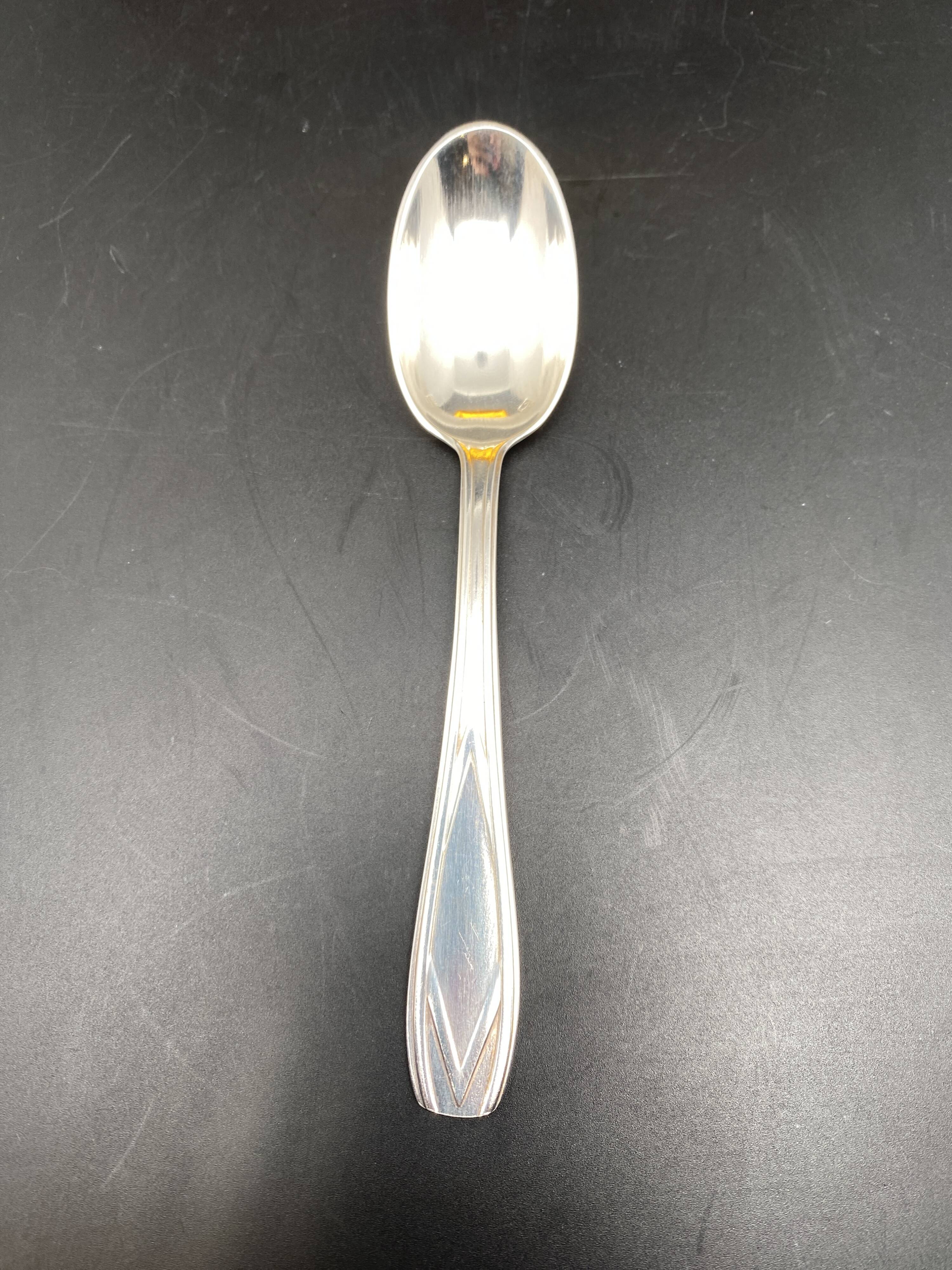 Dessert spoons in silver-white metal