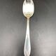 Dessert spoons in silver-white metal