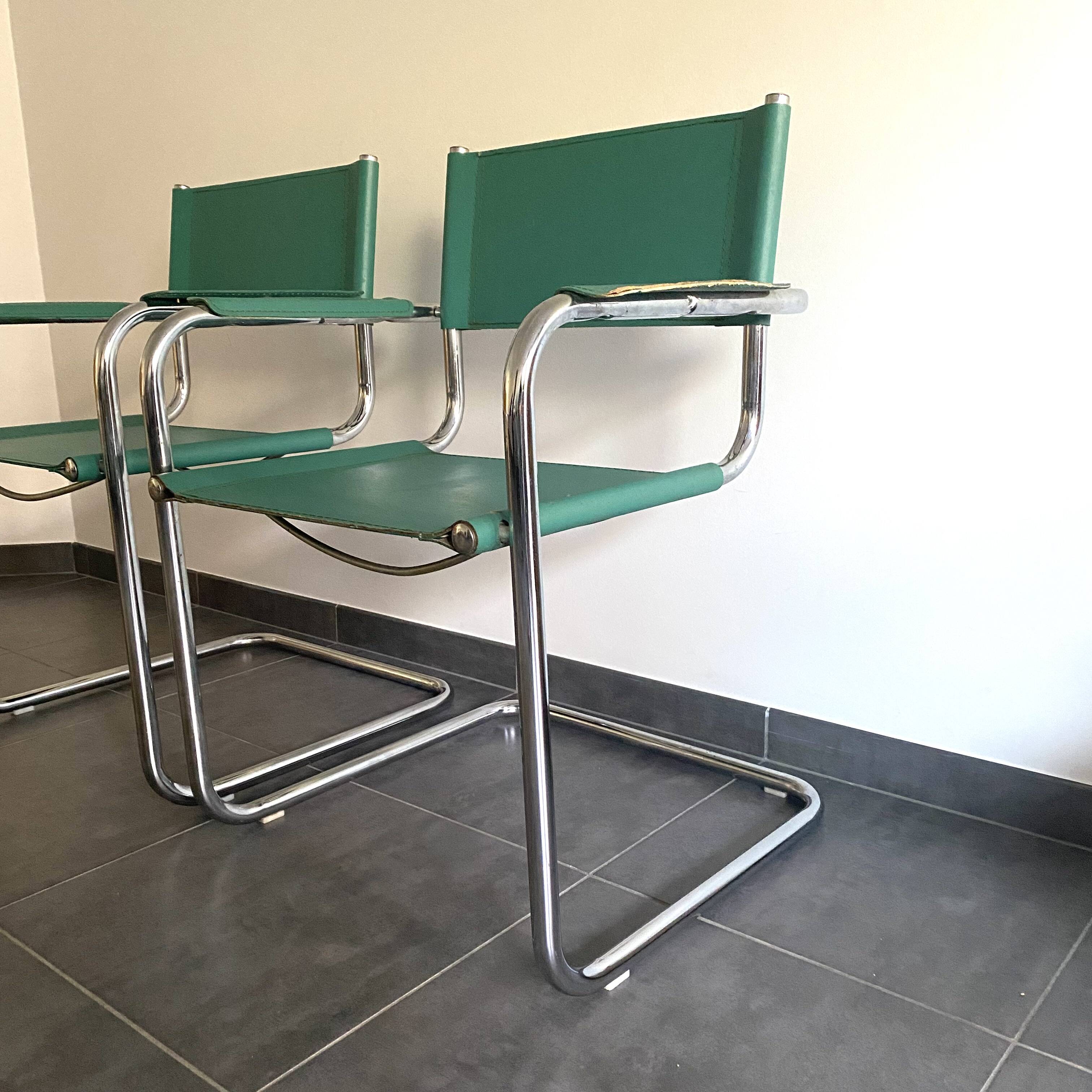 Pair of faux leather and chrome armchairs