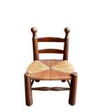 Brutalist low chair in dark wood and straw no. 2