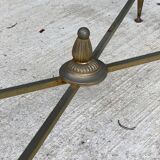 Regency style glass coffee table with crossed legs