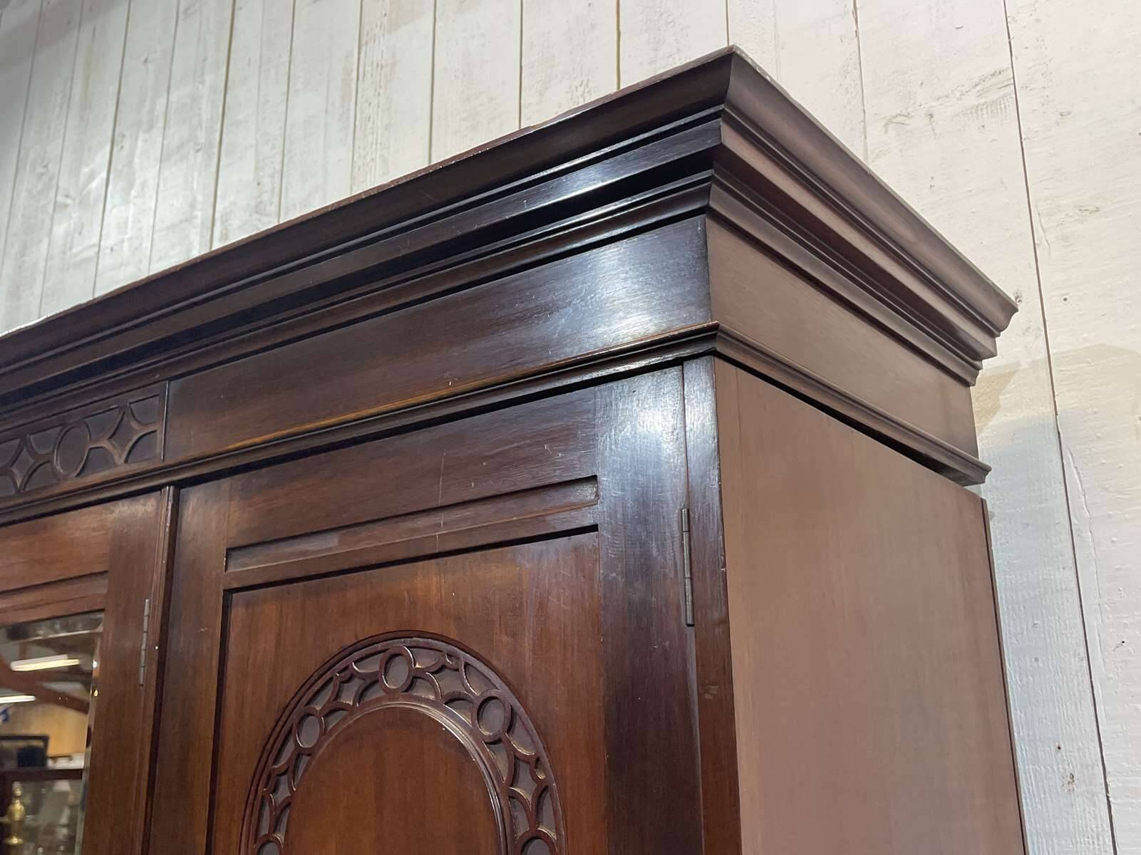 19th-century English mahogany three-door wardrobe.