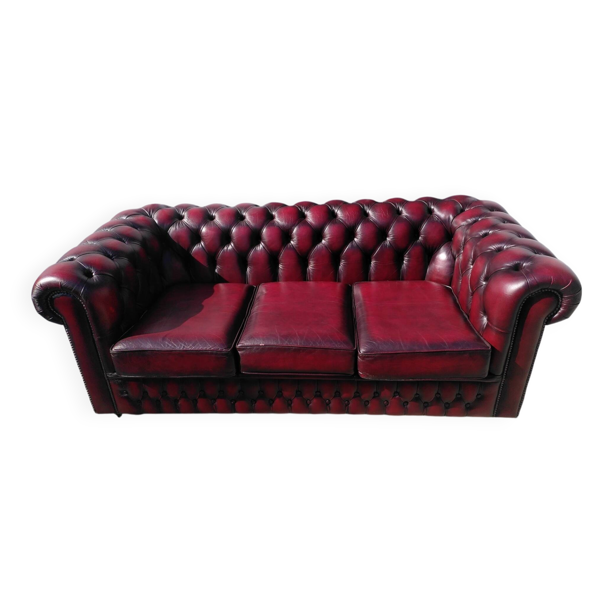 Burgundy Chesterfield-style sofa