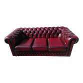 Burgundy Chesterfield-style sofa