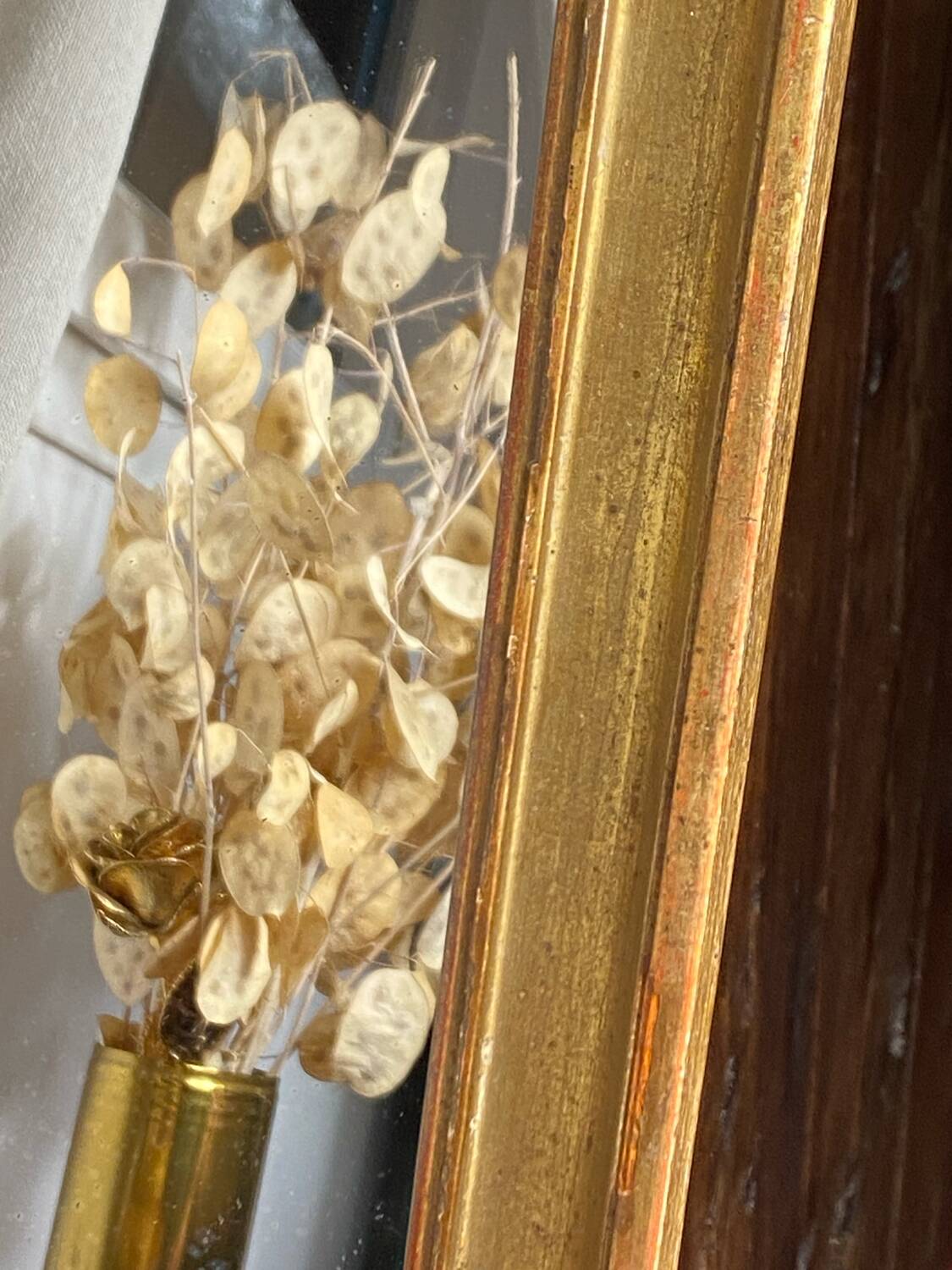 Antique mirror in gilded wood