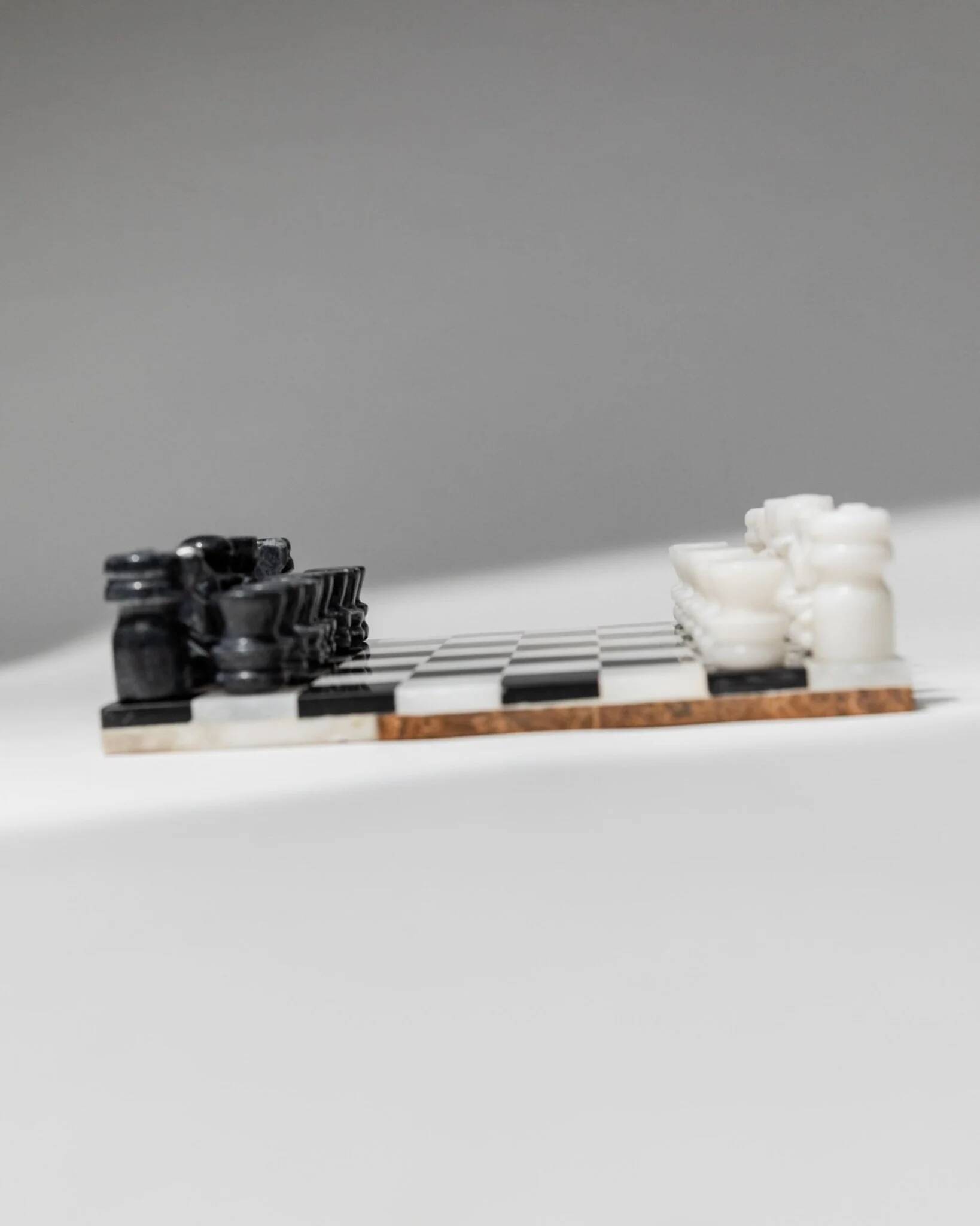 Vintage black-and-white marble chessboard with matching marble pieces, Italian 1960s design, sculptural centerpiece