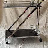 Modernist serving trolley in chromed metal and black smoked glass
