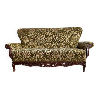 Vintage baroque chair with a rich floral pattern