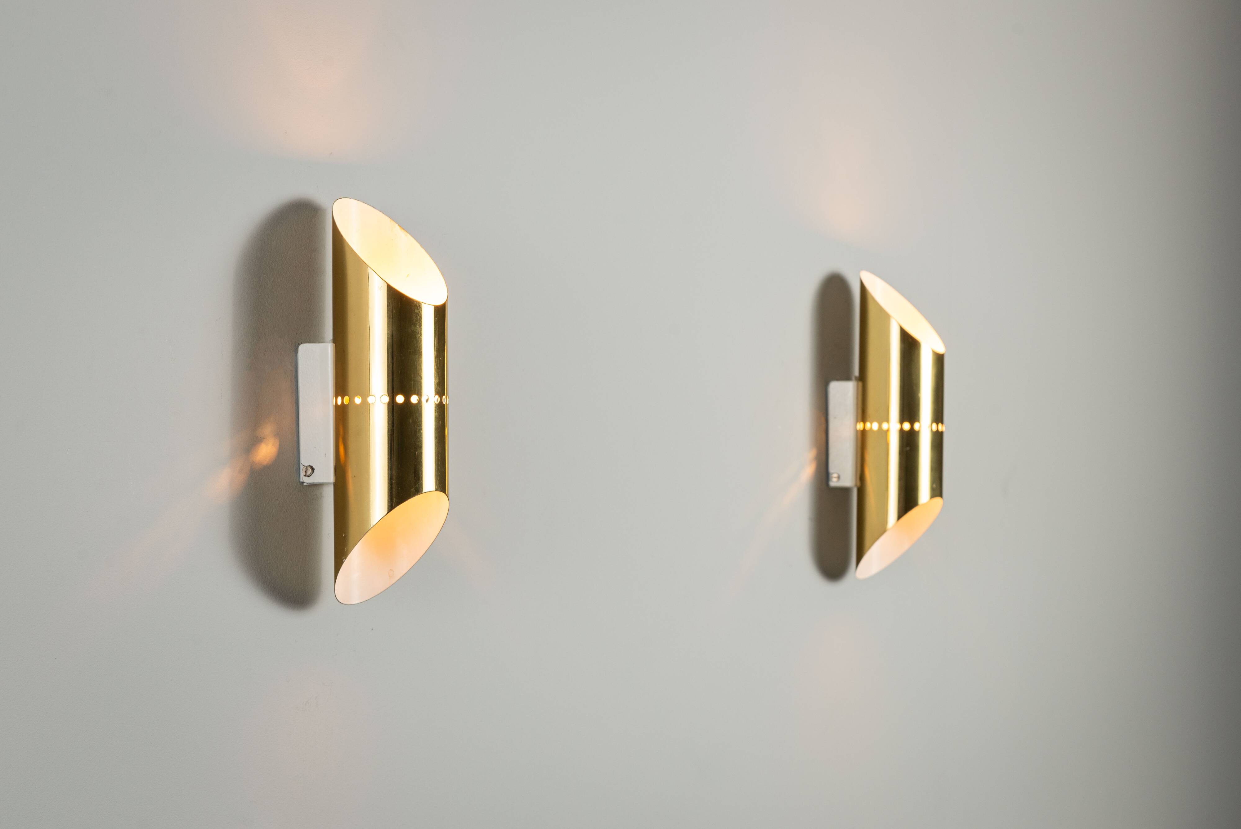 Pair of cylindrical wall lamps in brass with perforated shades