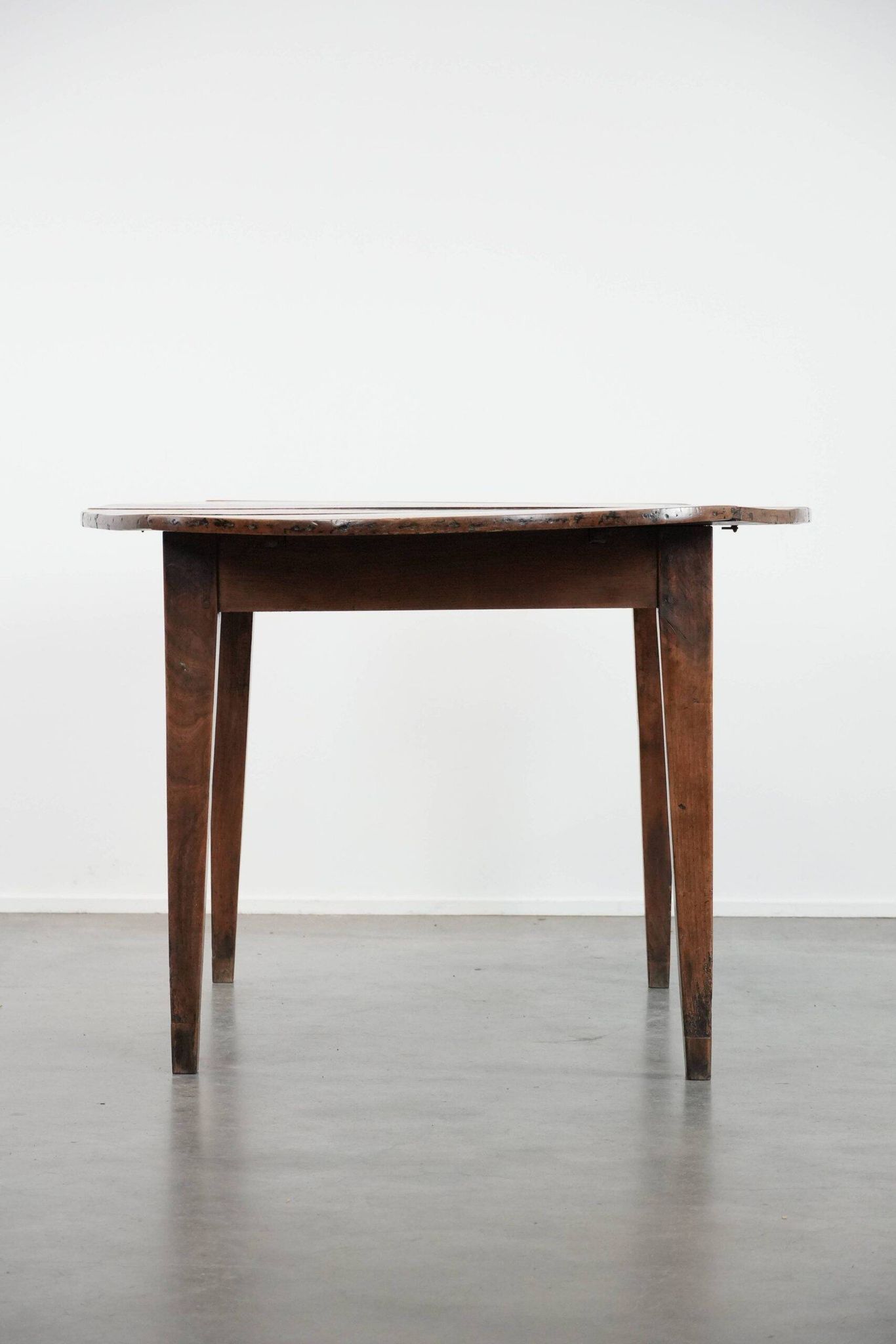 Rare antique oval French extendable dining table made of fruitwood