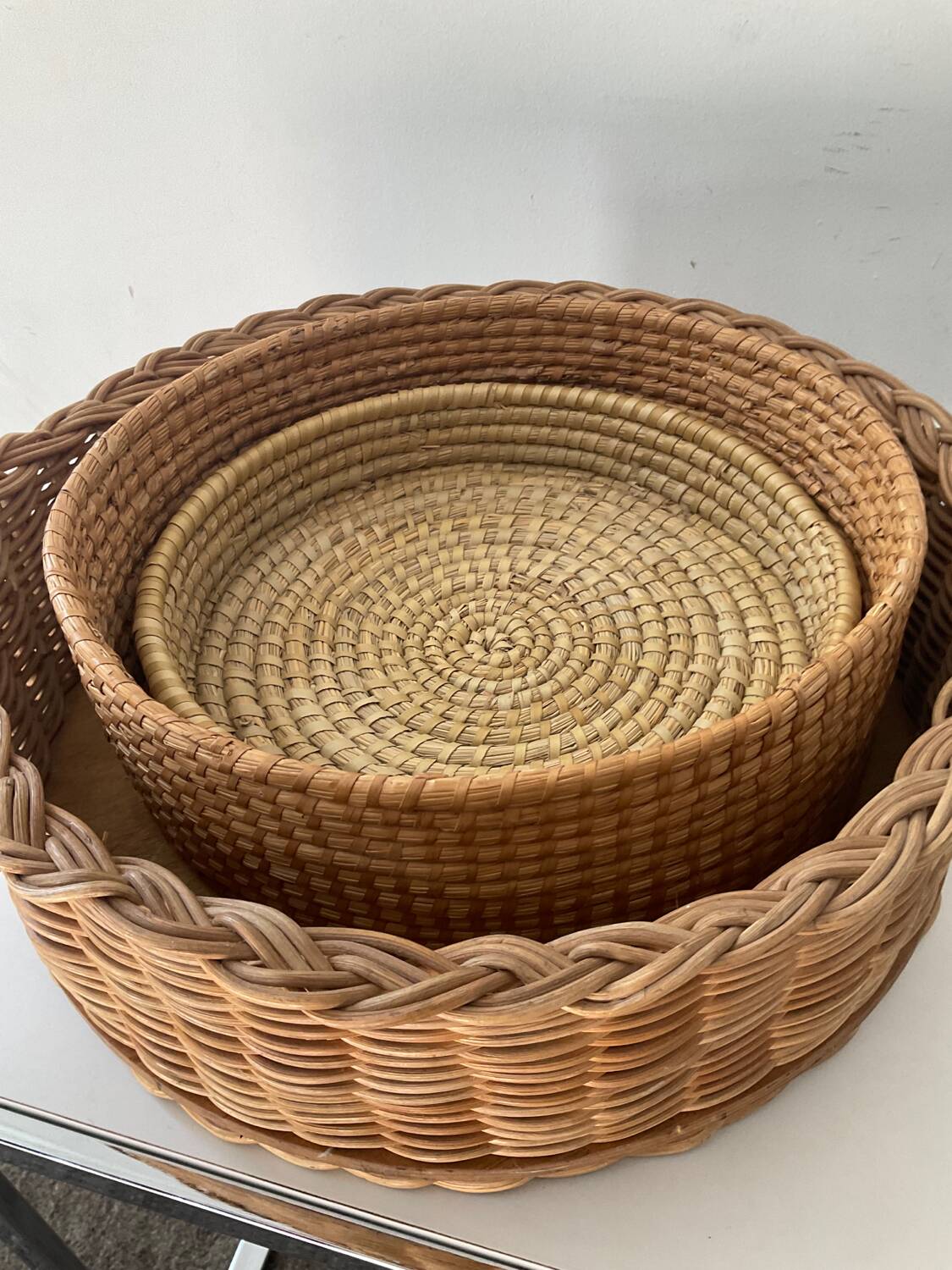 Trio of vintage wicker and woven raffia baskets