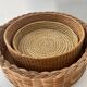 Trio of vintage wicker and woven raffia baskets