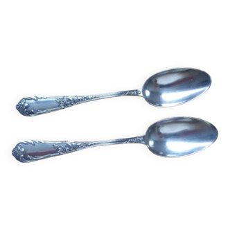 2 small white metal spoons