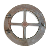 Fenêtre oeil de boeuf en fonte