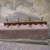 Wall coat rack has four hooks