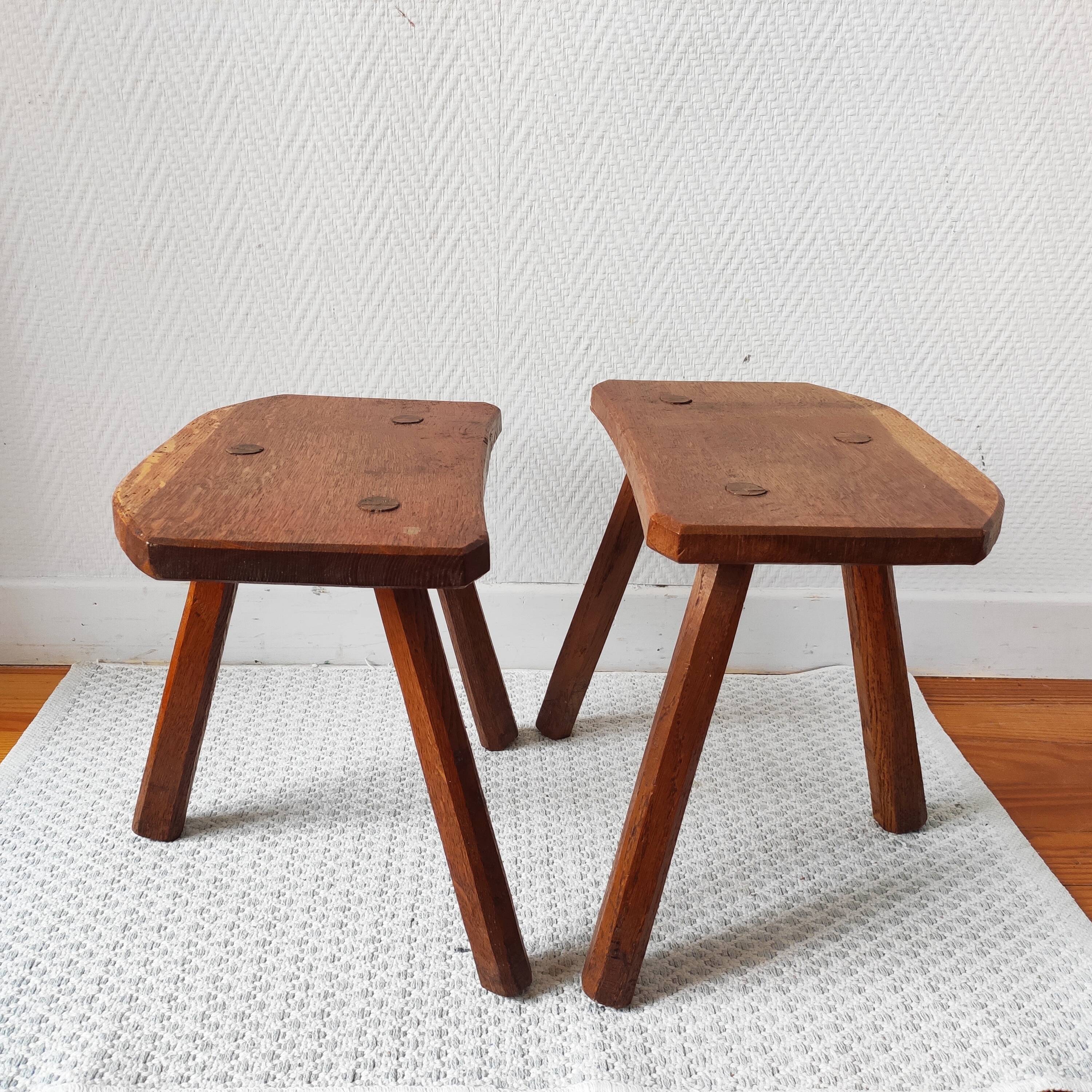 Pair of brutalist tripod stools in solid wood.