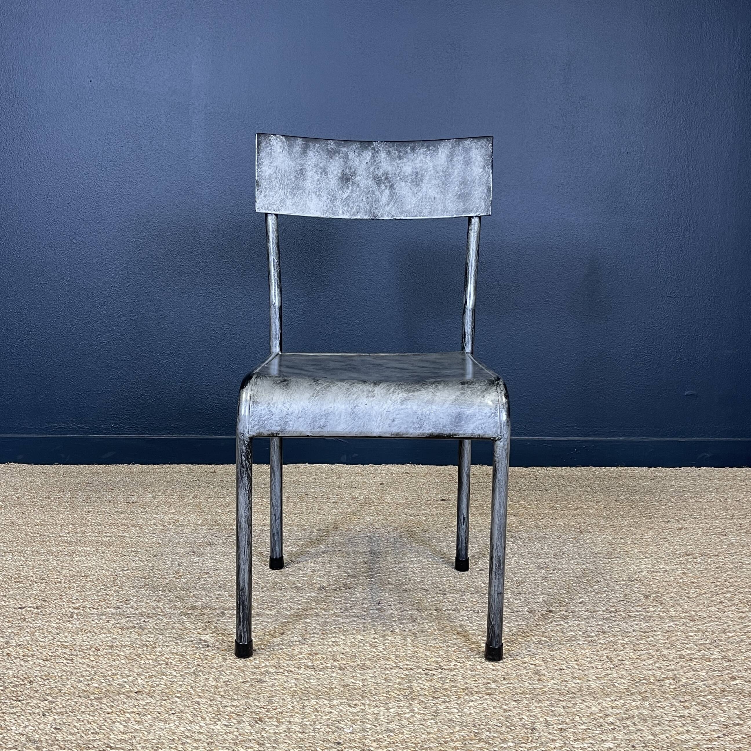 Pair of gray metal industrial chairs