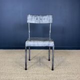 Pair of gray metal industrial chairs