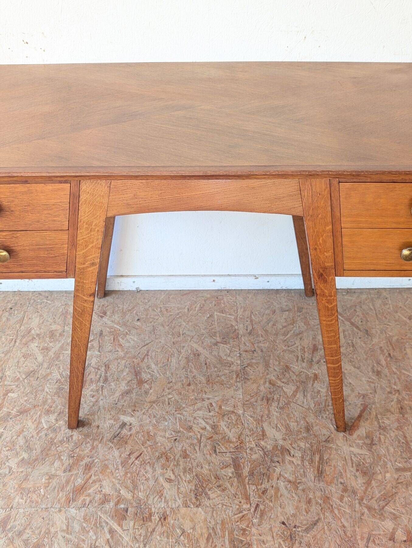 1950s oak double-sided desk with compass legs.