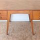 1950s oak double-sided desk with compass legs.