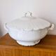White porcelain soup tureen from Limoges with a vegetal scroll design.