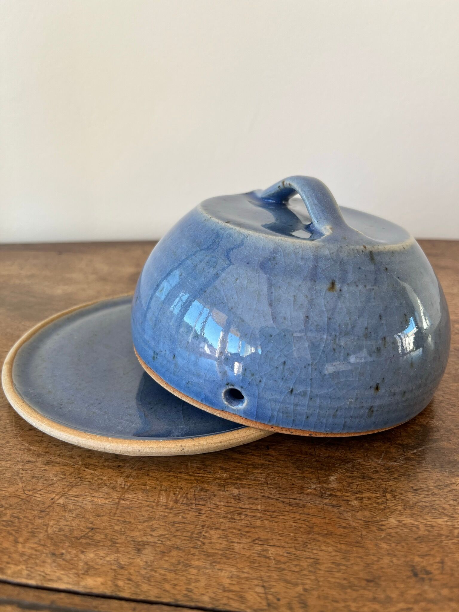 Cheese or butter bell and its blue sandstone dish
