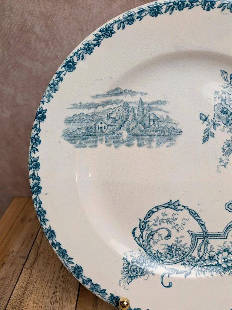 Dessert plate in ironstone Clairefontaine model Buffon blue with old landscape decoration.